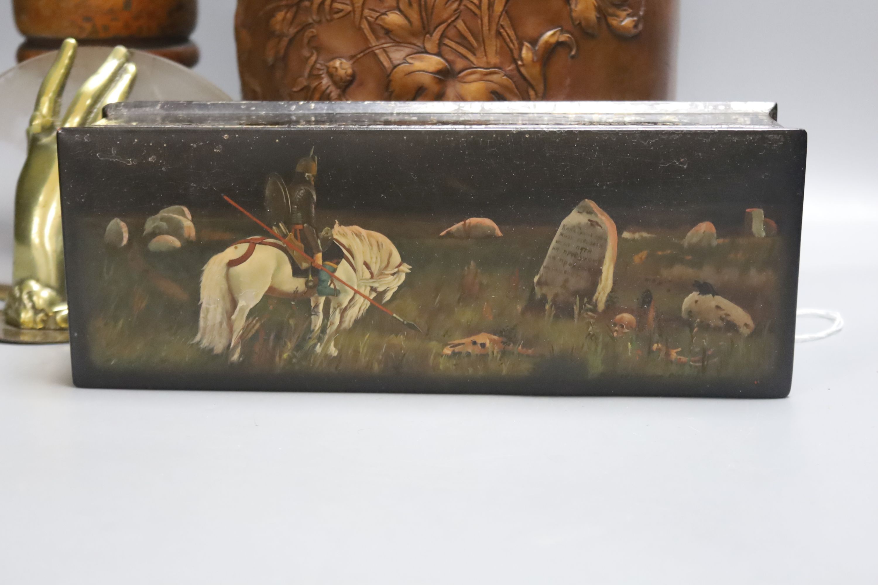 A Russian papier mache box, 26.5cm, an embossed leather stick stand, a Persian painted wood vase, metalware etc